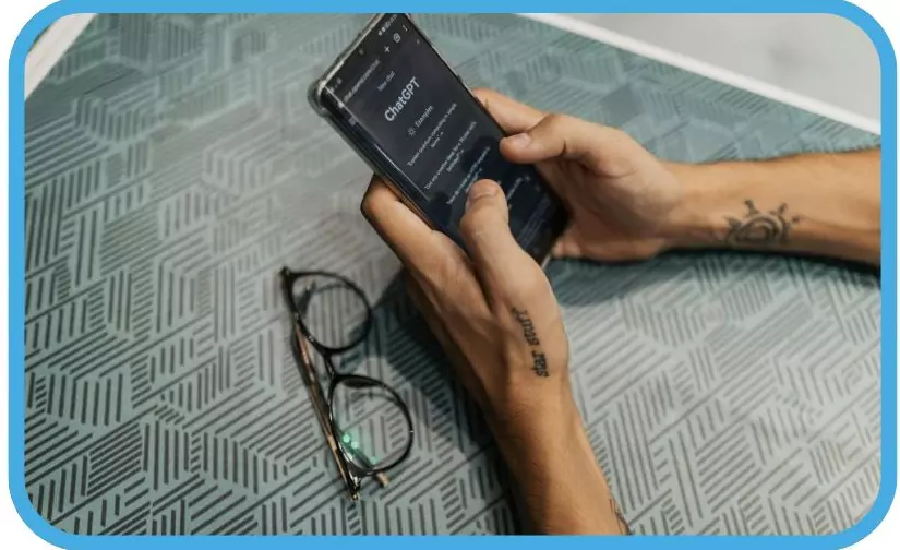 person using ChatGPT on a mobile device.